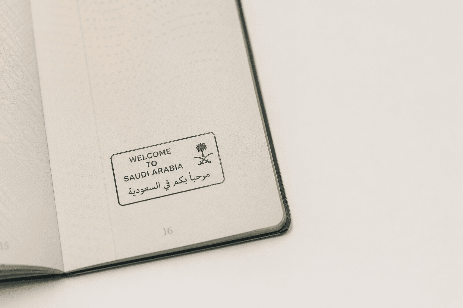 Open passport with a Saudi entry stamp